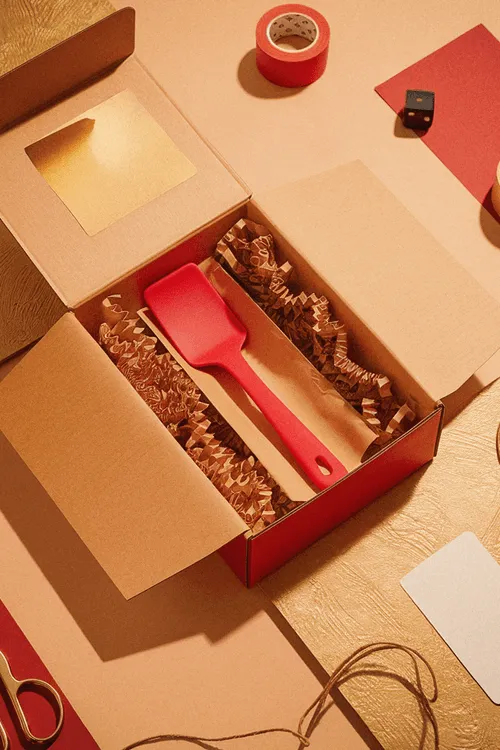 Box with spatula